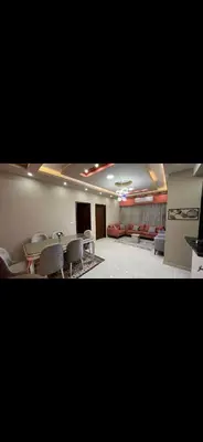 a living room with a table and chairs and a couch at GZ Resort in Hurghada