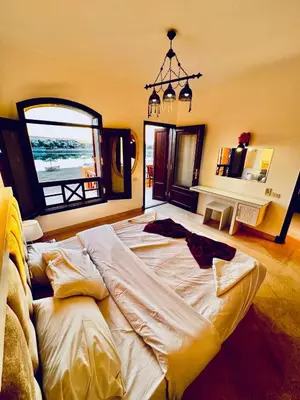 a large bed in the middle of a room at 2Bedroom in west golf in Hurghada