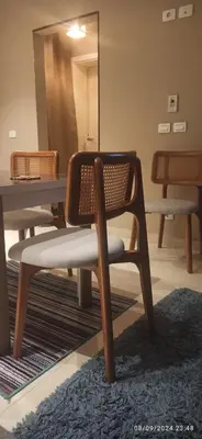 a chair sitting in front of a table with a mirror at Makadi Heights in Hurghada
