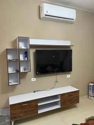 a living room with a flat screen tv on a wall at Makadi heights - phase 2 in Hurghada