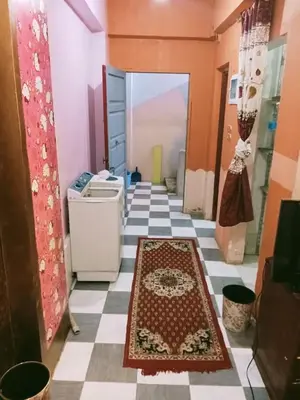a room with a tile floor with a rug on the floor at الشواربي السياحي كورنيش النيل in Aswan