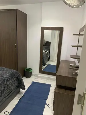 a bedroom with a bed and a large mirror at Fanadir Bay Resort, rental chalet apartment in Hurghadana in Hurghada