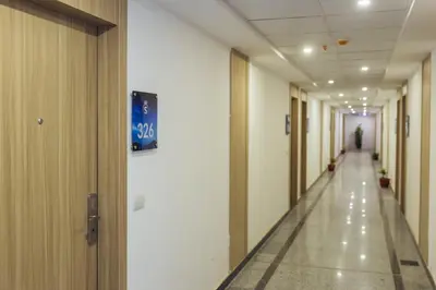 an empty hallway in a hospital with a sign on the wall at Sky Star Hotel free shuttle to Hurghada City Center in Hurghada