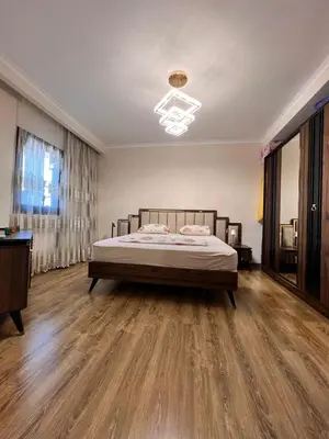 a bedroom with a bed and a wooden floor at One bedroom in Island View in Hurghada