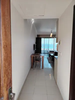 a hallway with a table and chairs in a room at Studio for rent 206 in Hurghada