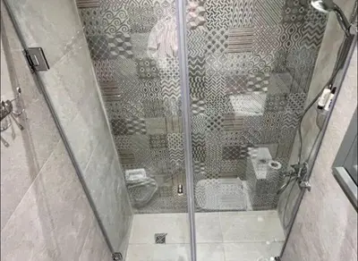 a shower with a glass door in a bathroom at Luxury One bedroom in gouna in Hurghada