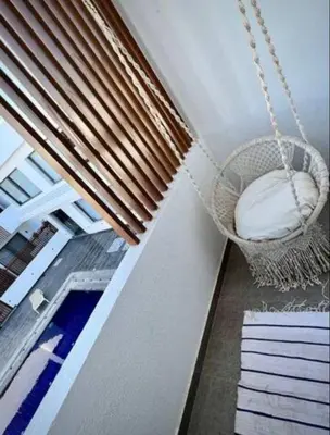 a porch with a hammock and a window at Luxury One bedroom in gouna in Hurghada