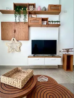 a living room with a television and a large rug at Luxury One bedroom in gouna in Hurghada
