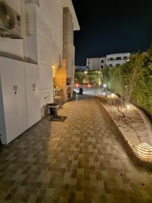 an empty street at night with a building at Sky star 130 in Hurghada