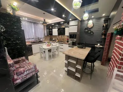 a kitchen with a table and a dining room at Sky star 130 in Hurghada