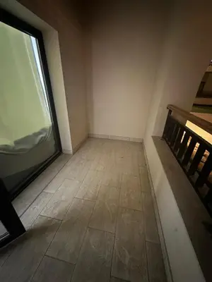 an empty room with a window and a tiled floor at Aldau heights 2 in Hurghada