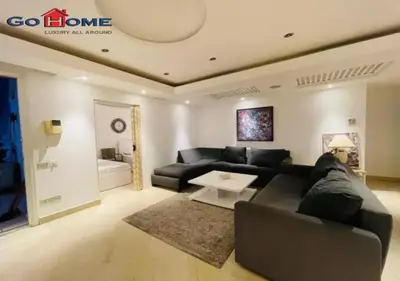 a living room with a couch and a table at Pretty 4Bedrooms Penthouse MB7 at New Abu Tig Marina in Hurghada