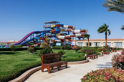 a water park with a roller coaster at Sunrise Solara Aqua park Resort in Banī Ghālib