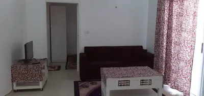 a living room with a couch and a chair at منزل عبد الرحيم العمدة in Luxor
