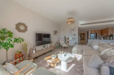 a living room with a couch and a table at Stylish 3 BR Retreat at Ancient Hills El Gouna in El Gouna