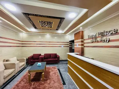 a lobby with a waiting room with red chairs at Royal palace in Hurghada
