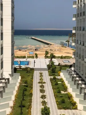 an aerial view of a beach and a building at Scandic Resort Hurghada in Hurghada