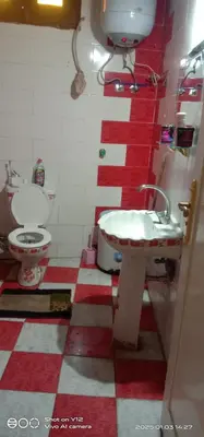 a bathroom with a sink and a toilet at Al Agamay Nile view guest House in Jazīrat Aswān