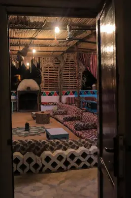 a room with a large bed in the middle at Carmah Nubian Guesthouse in Aswan