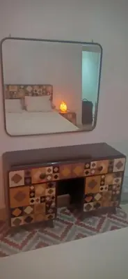 a bedroom with a vanity with a mirror on it at Good place to enjoy vacation in Hurghada