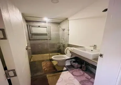 a bathroom with a toilet and a sink at Comfort 3BR Apartment C1-D with Private Heated Pool at Bali Elgouna in Hurghada