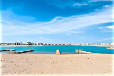 a beach with two docks in the water at Villa luxury 5bedroom in gouna in Hurghada
