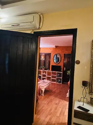 a living room with a air conditioner on the ceiling at شاليه في ستيلا مكادي الغردقة in Hurghada