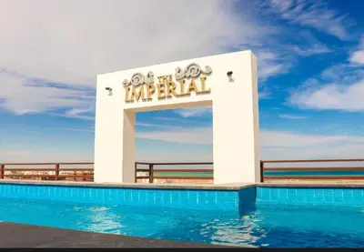 a sign for a hotel with a swimming pool at Studio pool view at Imperial Resort Hurghada in Hurghada