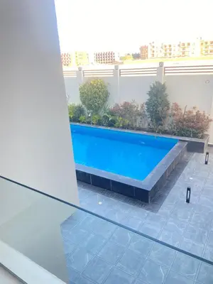 a swimming pool in the middle of a building at Studio pool view at Imperial Resort Hurghada in Hurghada