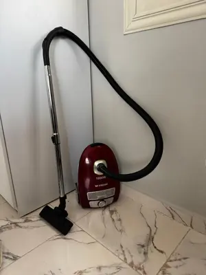 a red appliance sitting on a counter next to a wall at Seaside Serenity Apartment in Hurghada