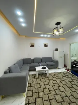 a living room with a couch and a table at Dana in Hurghada