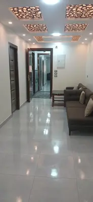 a large living room with couches and a lobby at Gannet Alyousef City Center in Naj‘ al Maḩaţţah