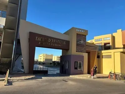a group of people standing outside of a building at Tiba Golden a in Hurghada