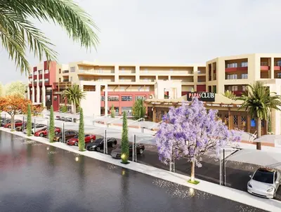 a street with cars parked in a parking lot at Studio in a touristic area - Al mamsha in Hurghada