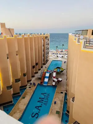 an overhead view of a swimming pool at the beach at الغردقه in Hurghada