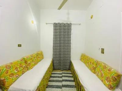 a room with two couches and a shower at Pharaoh apartment 2 in Luxor