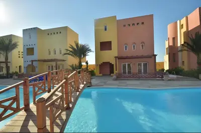 a resort with a swimming pool and some buildings at Home from Home Al Dora Residence in Hurghada