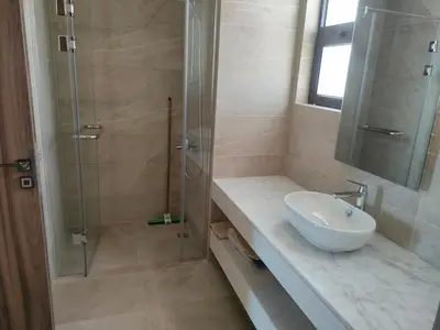 a bathroom with a sink and a glass shower at Stay at elgouna with private heated pool villa in Hurghada