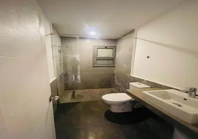 a bathroom with a toilet and a sink and a shower at Apartment 3 Bedrooms Bali BR C1-D with Private Pool at Bali in Hurghada