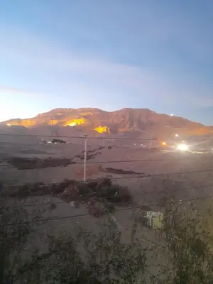 a view of a desert with mountains in the background at Mountain hug house in Luxor