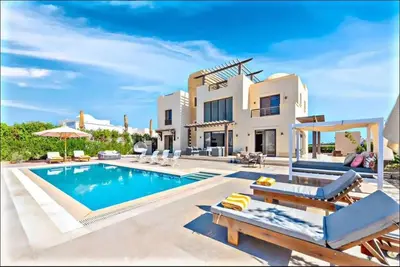 a villa with a swimming pool and a house at Luxury villa in gouna in El Gouna