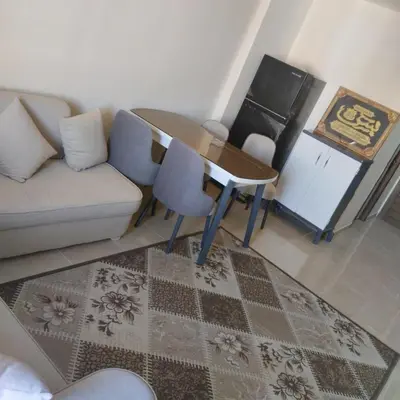 a living room with a couch and a table at Golden Tayeb Hurghada Compound in Hurghada