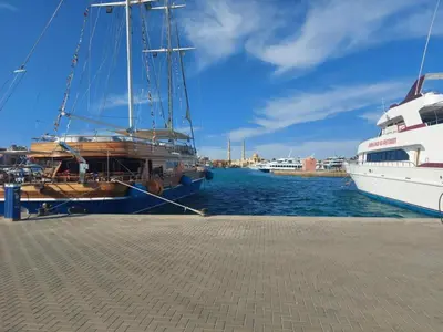 a boat is docked at a dock in the water at Florenze Khamsin Hurghada in Hurghada
