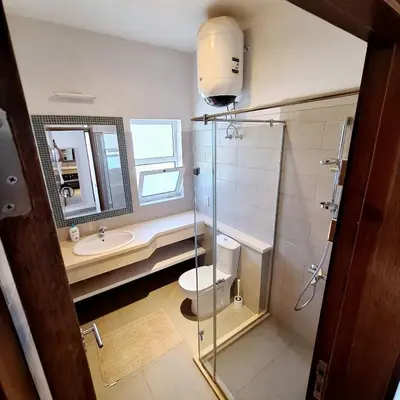 a bathroom with a toilet and a sink and a mirror at 2 Bedrooms First floor in Waterside Residence in Hurghada