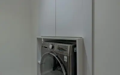 a washing machine with its door open in a room at Relax in Style I Lagoon-Front 2BR in Swan Lake El Gouna in Hurghada