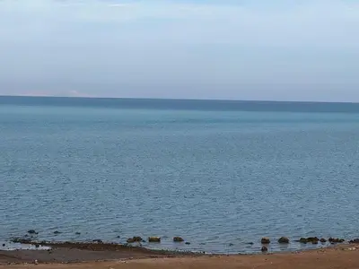 a large body of water with rocks in it at Hurghada Fanadir Bay in Hurghada