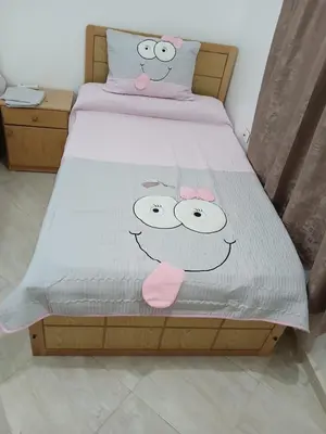 a bed with two hello kitty pillows on it at H&H Twin Apartment in Hurghada