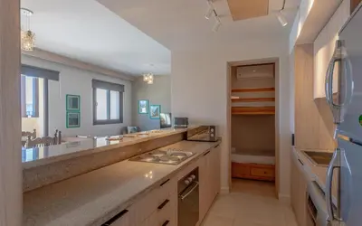 a large bathroom with a sink and a large mirror at Relaxing 3BR Fanadir Marina Home l El Gouna Red Sea l Lagoon Views in Hurghada