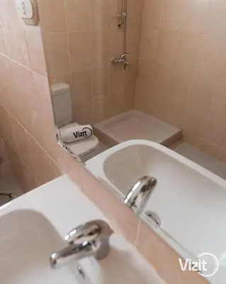 a bathroom with a sink and a tub and a toilet at Stylish flat with terrace in Hurghada