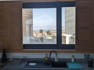 a kitchen with a sink and a window with a view at Stylish Seaview 2BR Soma bay Villa with Free Pool & Beach in Hurghada